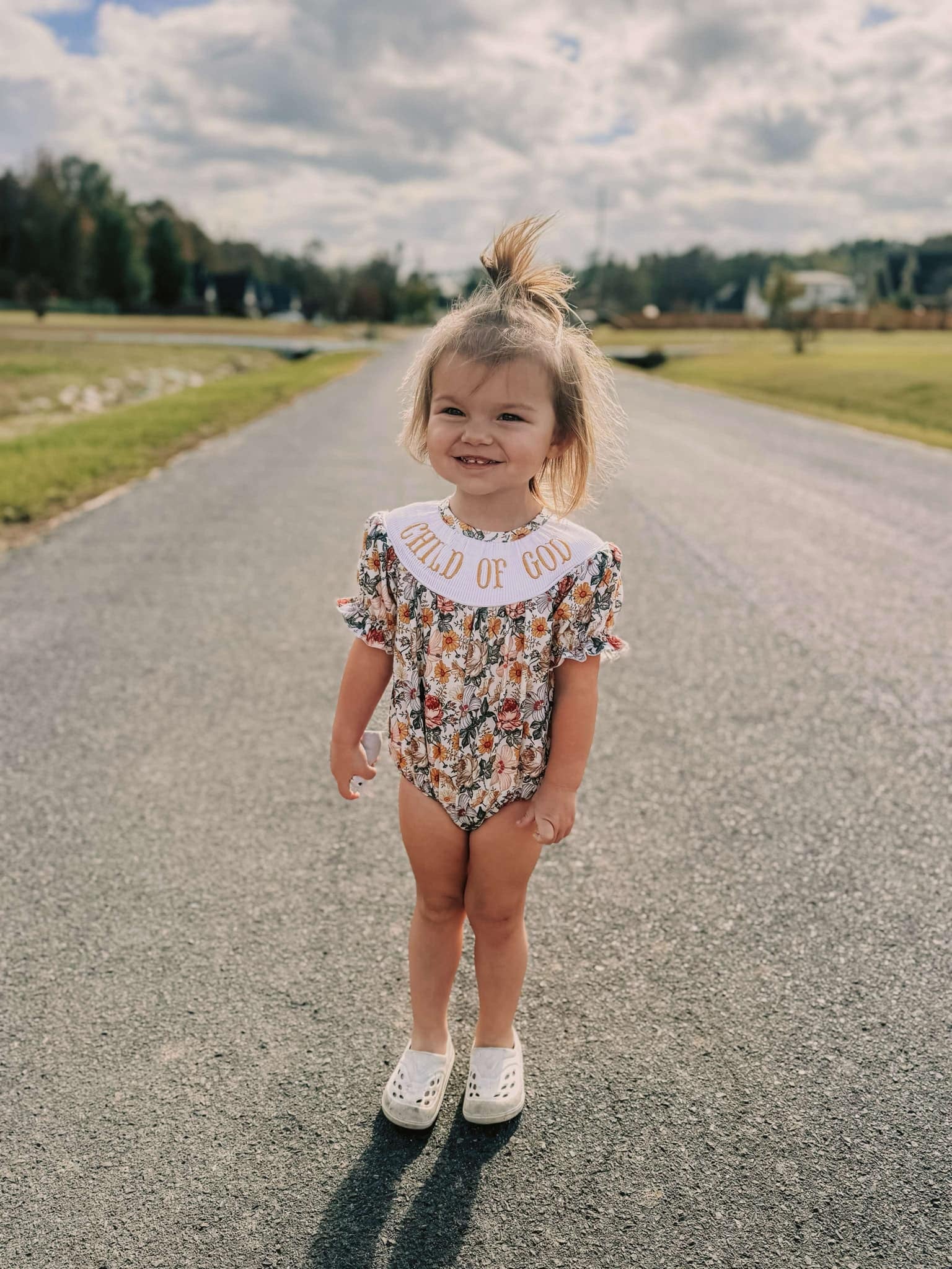 Vintage floral Smocked child of god romper