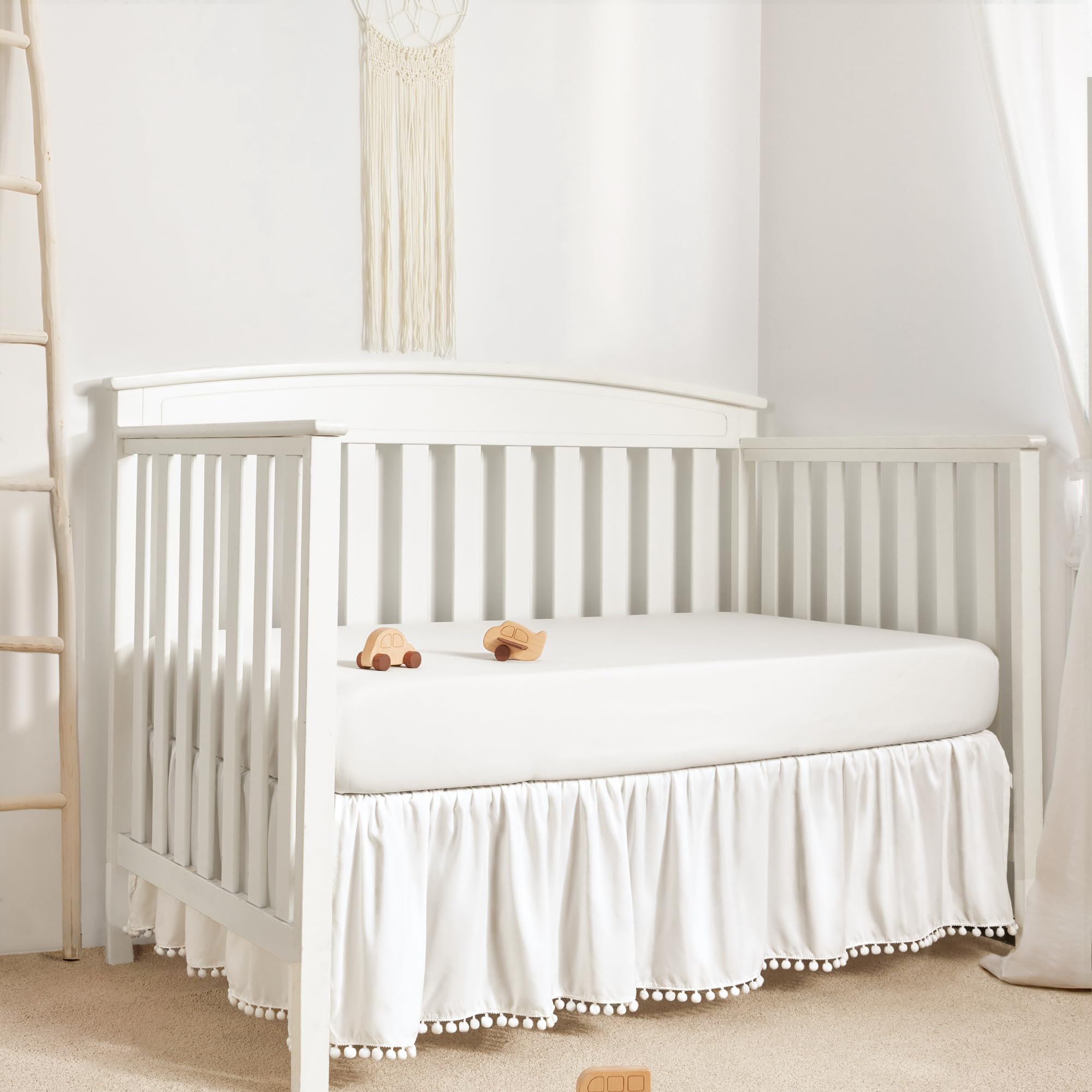 TILLYOU Baby Crib Skirt Girls Boys, Ruffled Bed Skirt with Pompoms, 28”x 52”, 14'' Drop, White