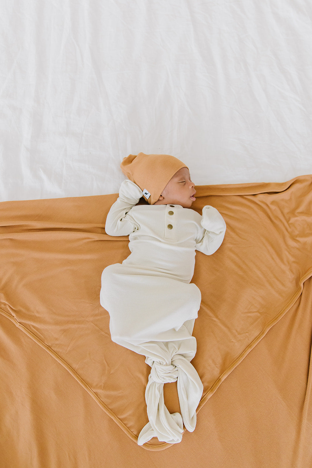 camel ribbed top knot hat
