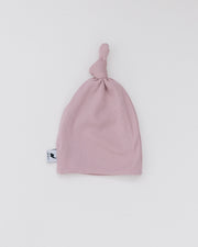 blush ribbed top knot hat
